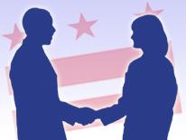 A photo of two people shaking hands with a District flag in the background